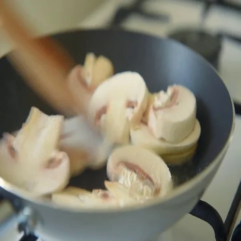 Frying mushrooms in vegetable oil Stock Footage 69483477