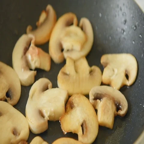 Frying mushrooms in vegetable oil Stock Footage 69483480