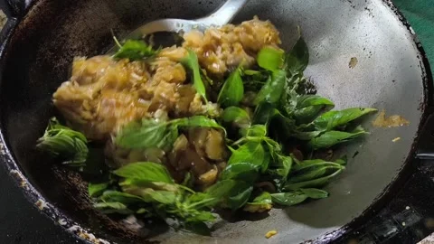 Frying noodles with basils in pan, in door  Chiangmai  Thailand. Stock Footage 308210487