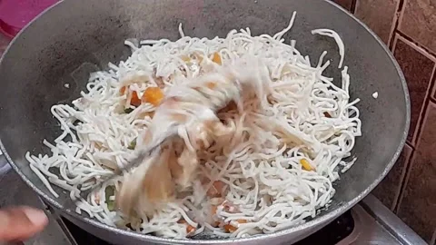 Frying noodles  in a pan Stock Footage 138028136