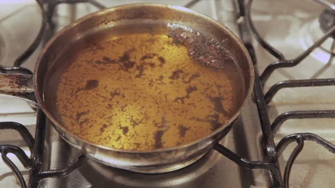 Frying Oil Burning And Making Smoke. A Risk Of fire And Burns Of Degrees. Stock Footage 152486810