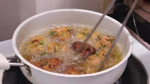 Frying in oil the indian snacks veg pakora  Stock Footage 328723926