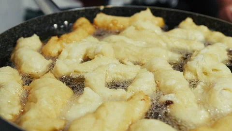Frying Oil In The Pot Full Of Zeppole Stock Footage 314865695
