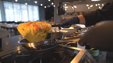 Frying omelette for breakfast in fancy restaurant Stock Footage 99401760