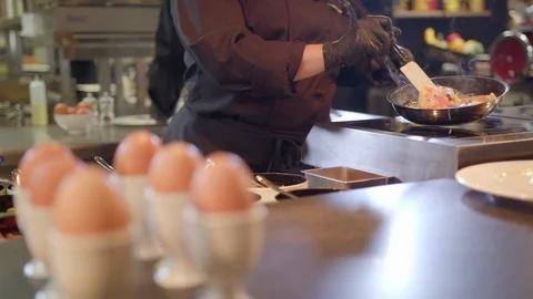Frying omelette for breakfast menu in restaurant Stock Footage 99577506