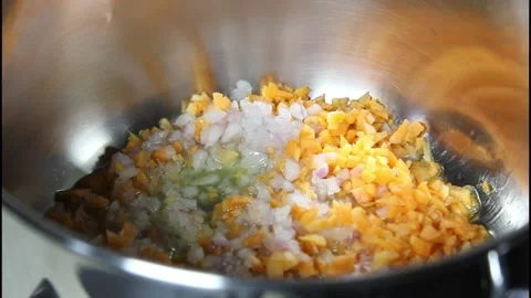 Frying onion and carrots. Stock Footage 234069550