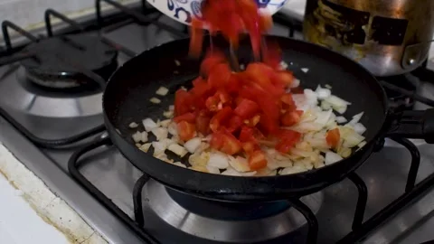 Frying Onion and Tomato in Pan, Cooking Onion with Tomato on Stove, Sauteing Stock Footage 315194015