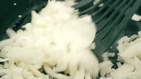 Frying onion on cooking pan Stock Footage 135274803