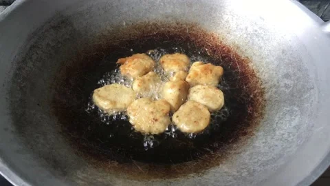 Frying an Onion Fritters Stock Footage 145813441