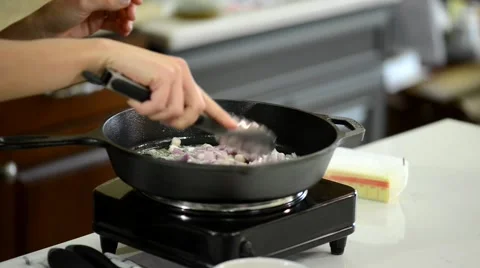 Frying Onion in a Frying Pan Stock Footage 54781791
