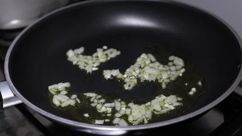 Frying onion on frying pan Video stock 125756205