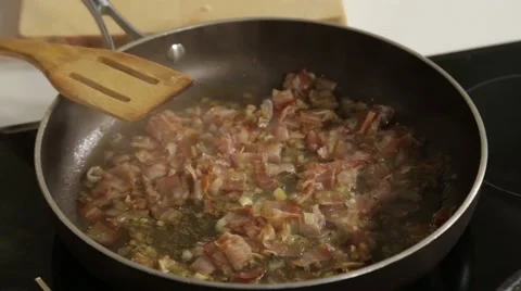 Frying onions with bacon Stock Footage 49781828