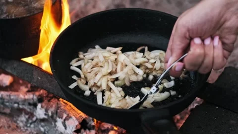 Frying Onions on Campfire Stock Footage 303707675