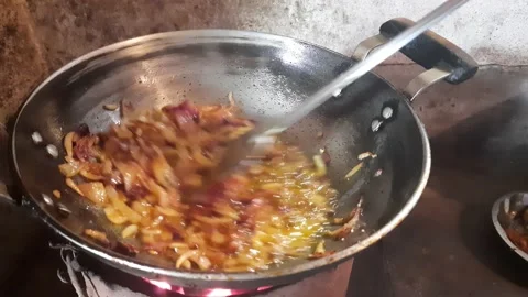Frying onions a Frying Pan. Stock Footage 157364370