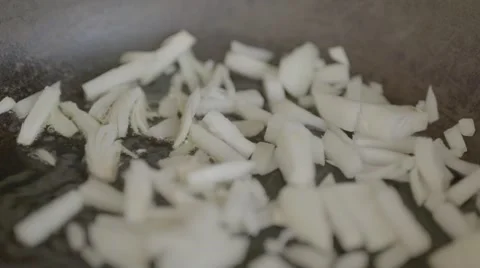 Frying onions, slow motion Stock Footage 56778074