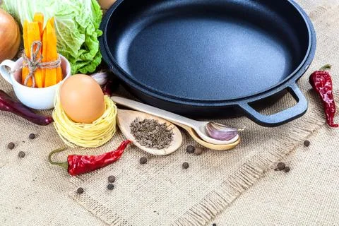Frying pan and fresh vegetables. Stock Photos