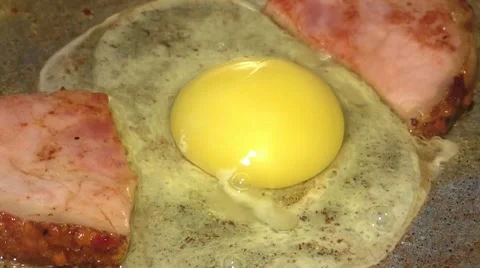 Frying Pan with Bacon and Eggs Stock Footage 44386861