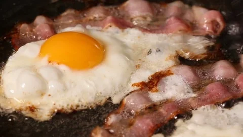 Frying Pan with Bacon and Eggs Stock Footage 82745048