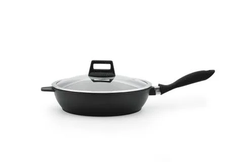A frying pan with a black plastic handle; a glass lid; isolate against a whit Foto stock
