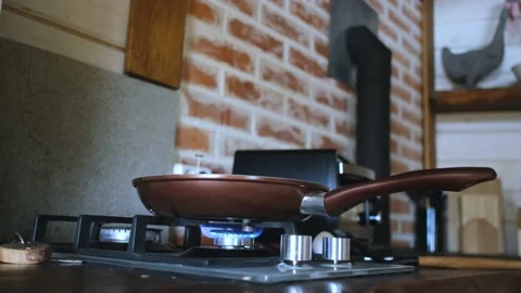 Frying pan on a burning gas stove Stock Footage 200818928