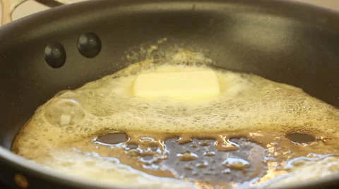 Frying pan with butter Lasagna rolls Recipe Stock Footage 68560857