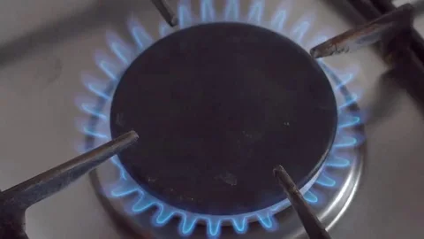 Frying pan with chikken fillet on gas stove Stock Footage 69075436
