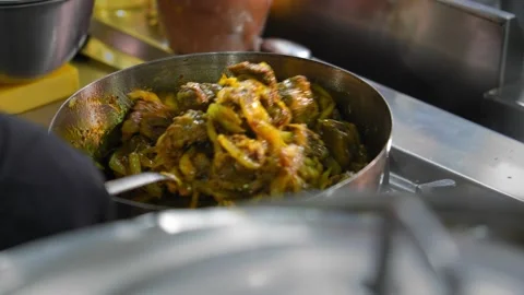 Frying pan with cooking stew and ingredients in frying pan in kitchen. Stock Footage 267283573