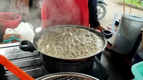 Frying pan is a device for cooking Stock Footage 232985773