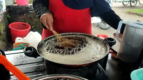 Frying pan is a device for cooking Stock Footage 232985810