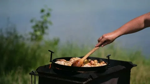 Frying pan from disc harrow with a lid for cooking over an open fire. Stock Footage 134082205