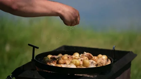 Frying pan from disc harrow with a lid for cooking over an open fire. Stock Footage 134084548