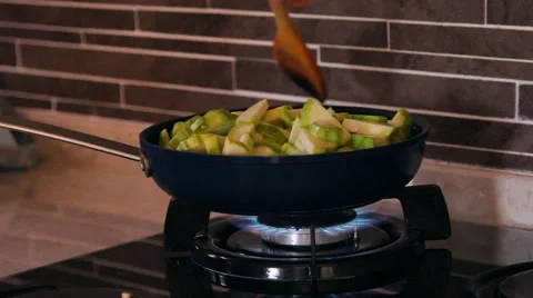 Frying pan on fire, vegetable marrows mix in a frying pan Video stock 40344947