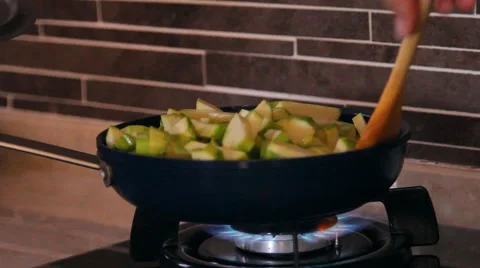 Frying pan on fire, vegetable marrows mix in a frying pan Stock Footage 40344999