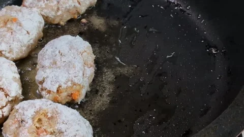 Frying pan with fish cakes and sizzling oil close-up, cooking homemade food, lif Stock Footage 310744437