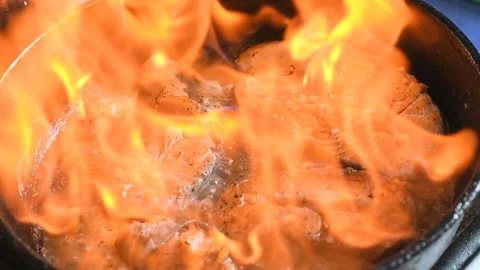 Frying pan fish trout salmon stake flaming fire Видео 134947463