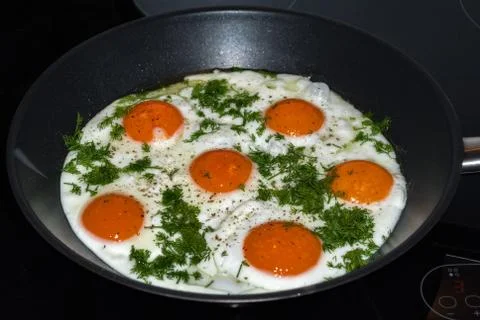 Frying pan with fried eggs. Stock Photos