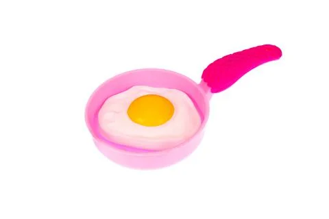 Frying pan with fried eggs Stock Photos