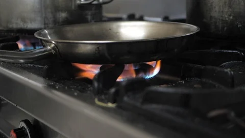 Frying pan on gas stove Stock Footage 119391380
