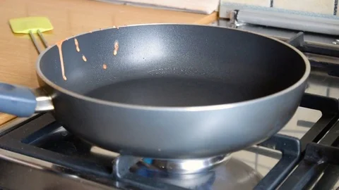 Frying pan greased with butter Stock Footage 70874539