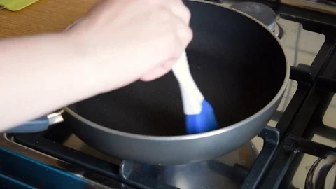 Frying pan greased with butter Stock Footage 70883252