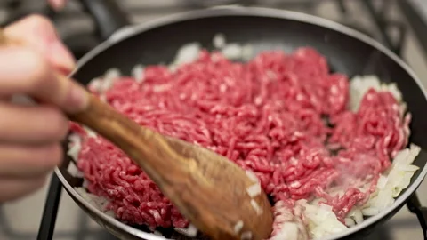 Frying in pan ground beef with onions and spices. Stock Footage 135312708