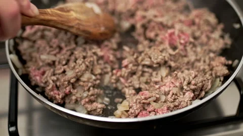 Frying in pan ground beef with onions and spices. Stock Footage 135461688