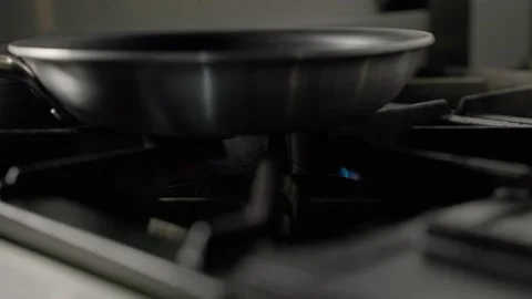 Frying Pan Heating on Gas Stove Flame Stock Footage 313042145