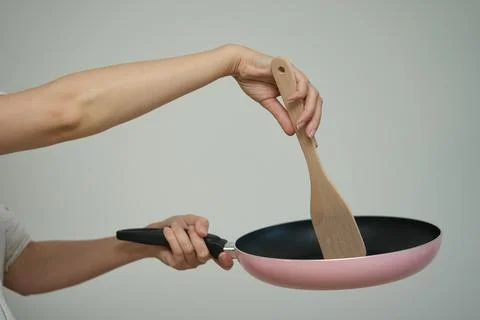 Frying pan in human hands, Cooking concept. Stock Photos