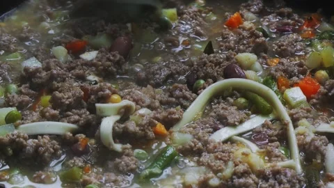 In a frying pan with minced meat  Stock Footage 296550453