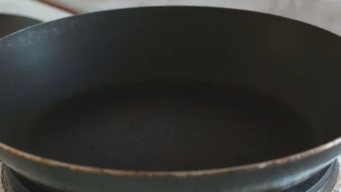 In a frying pan pour vegetable oil Stock Footage 108000396