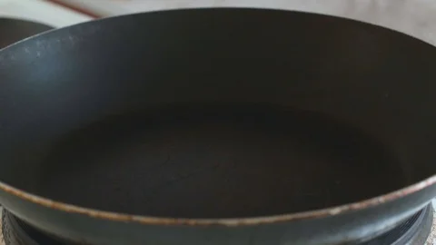In a frying pan pour vegetable oil slowmotion Stock Footage 108000421