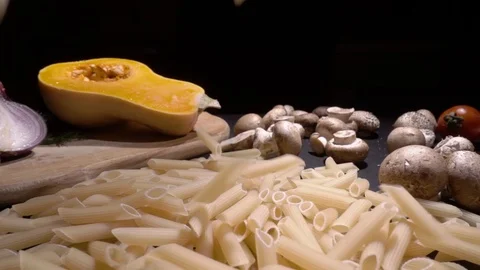 Frying Pan with Raw pasta Macaroni. Fall in slow motion Stock Footage 101926790