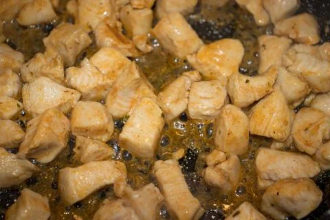 Frying Pan with Roasted chicken. Selective focus. Stock Photos