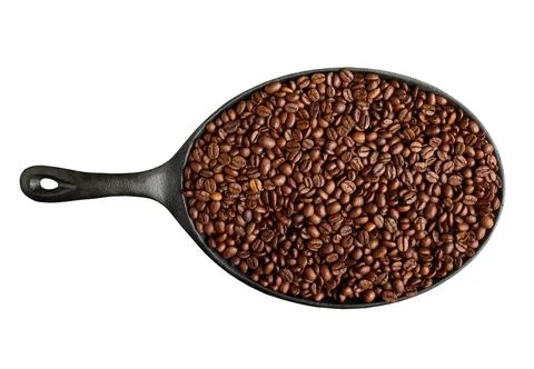Frying pan with roasted coffee beans isolated on white background Stock Photos